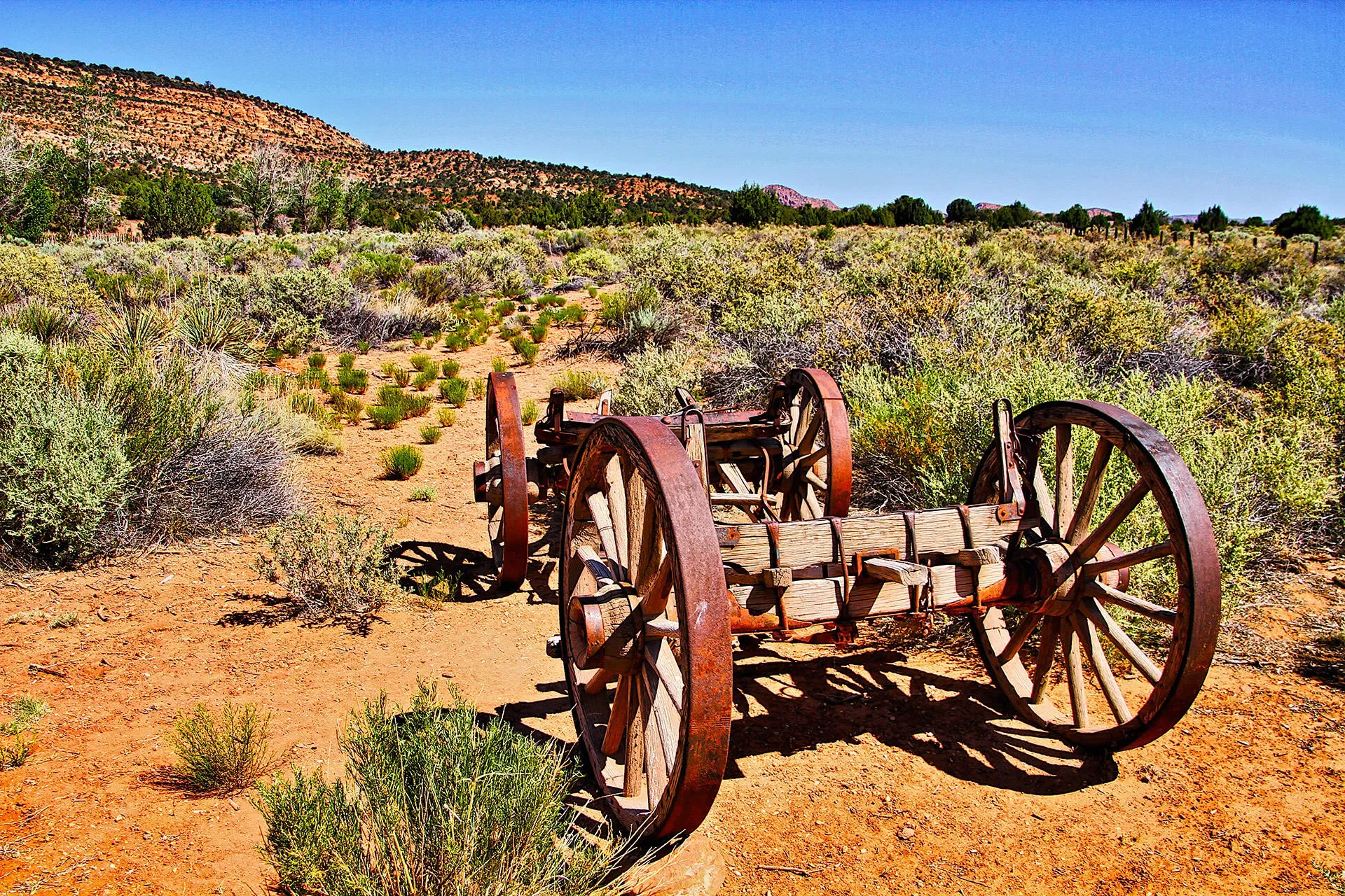 a wagon sits in a craggly landscape