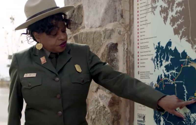 A National Park Service Employee points to a spot on a map