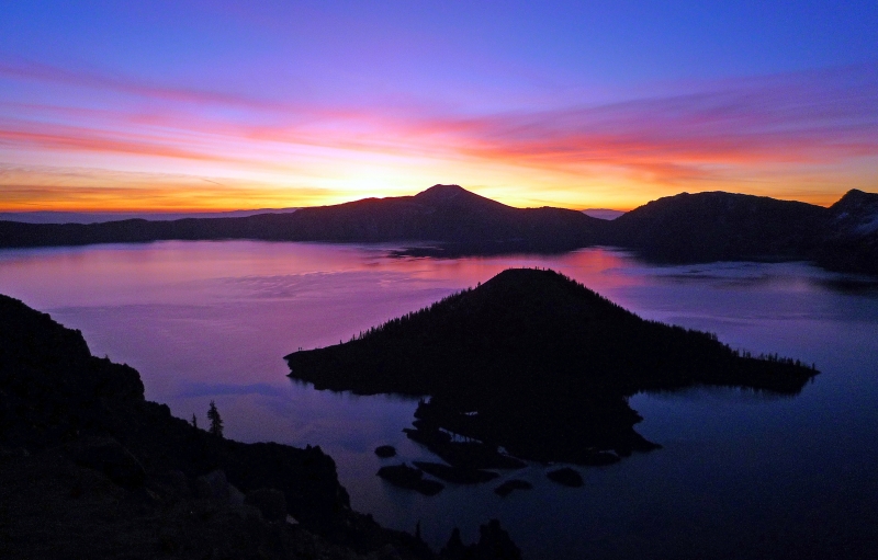 Rainbow-colored sunrise over Crater Lake National Park