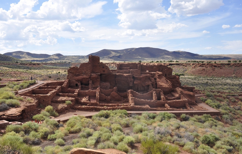 Image of Wupatki National Monument red, stone ruins in arid desert landscape 