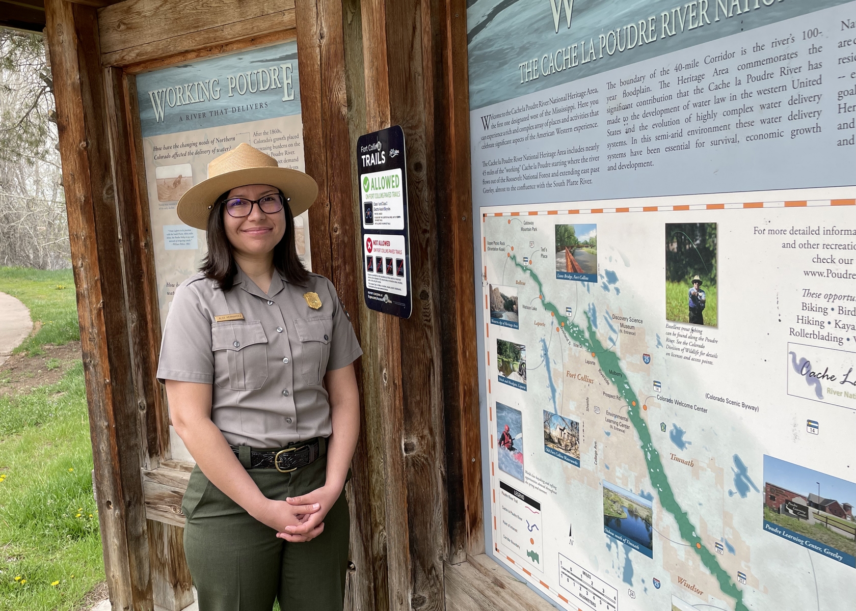 Alex Hernandez stands by a wayside exhibit 