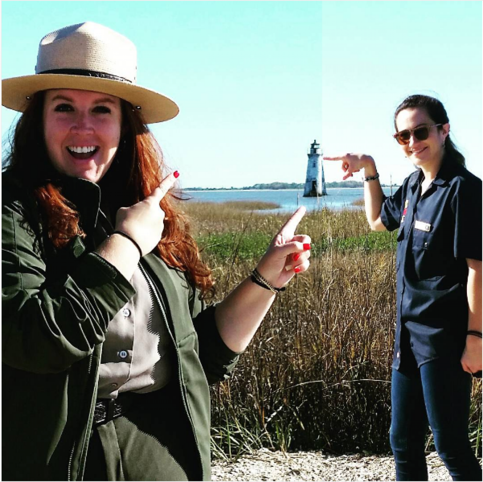 Park Ranger pointing at lighthouse 