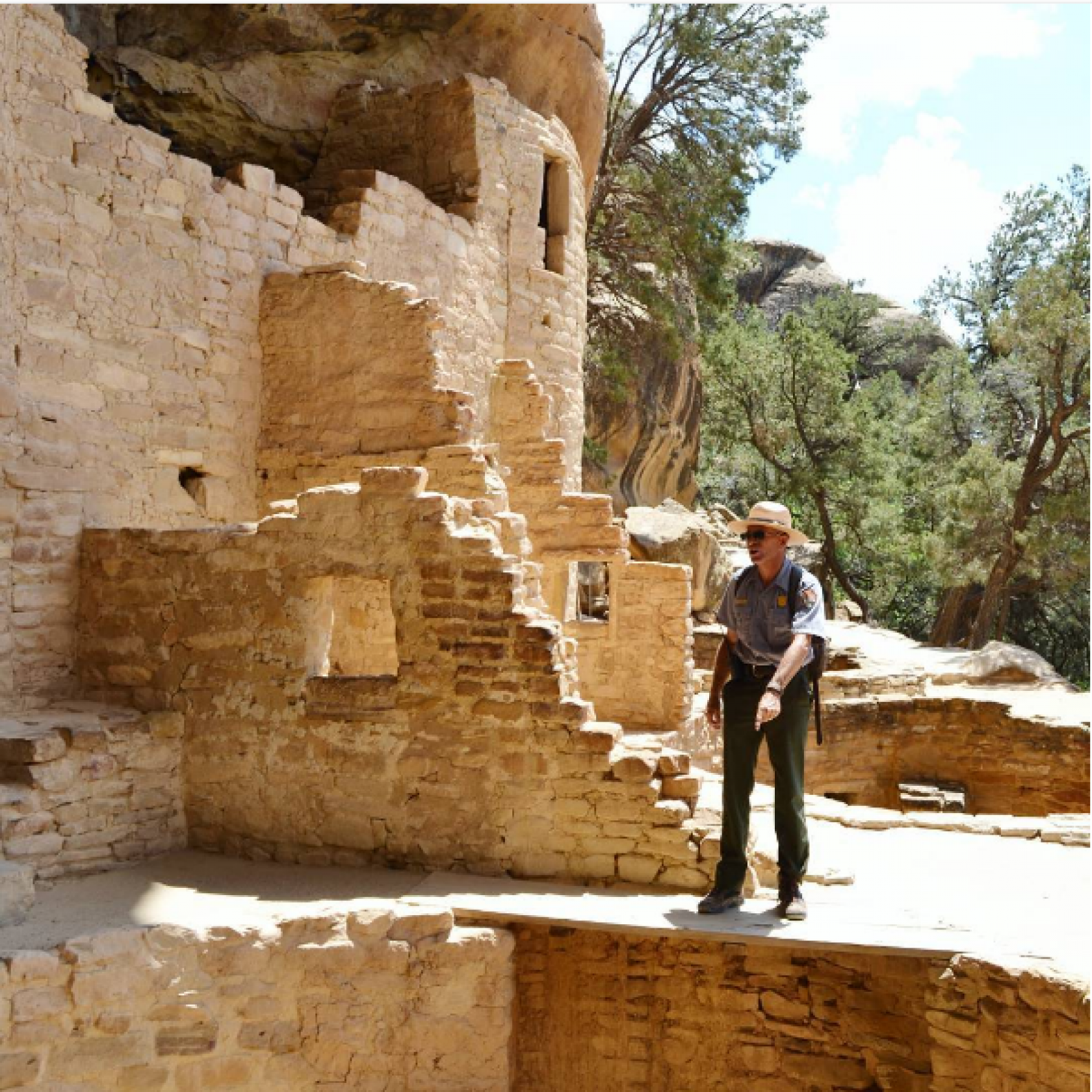 Park ranger in a pueblo structure