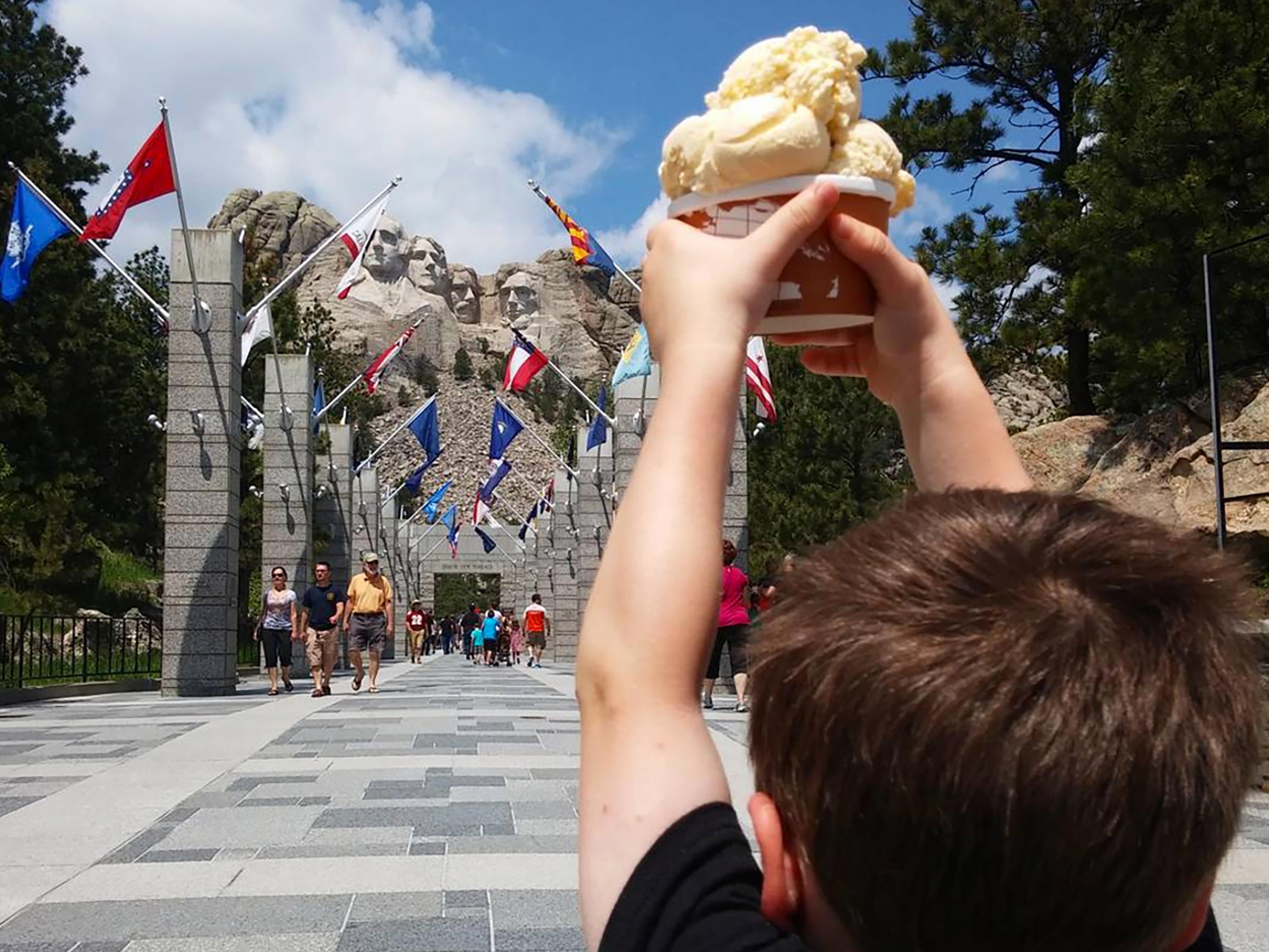 A kid enjoying TJ's Ice cream at Mount Rsuhmoore