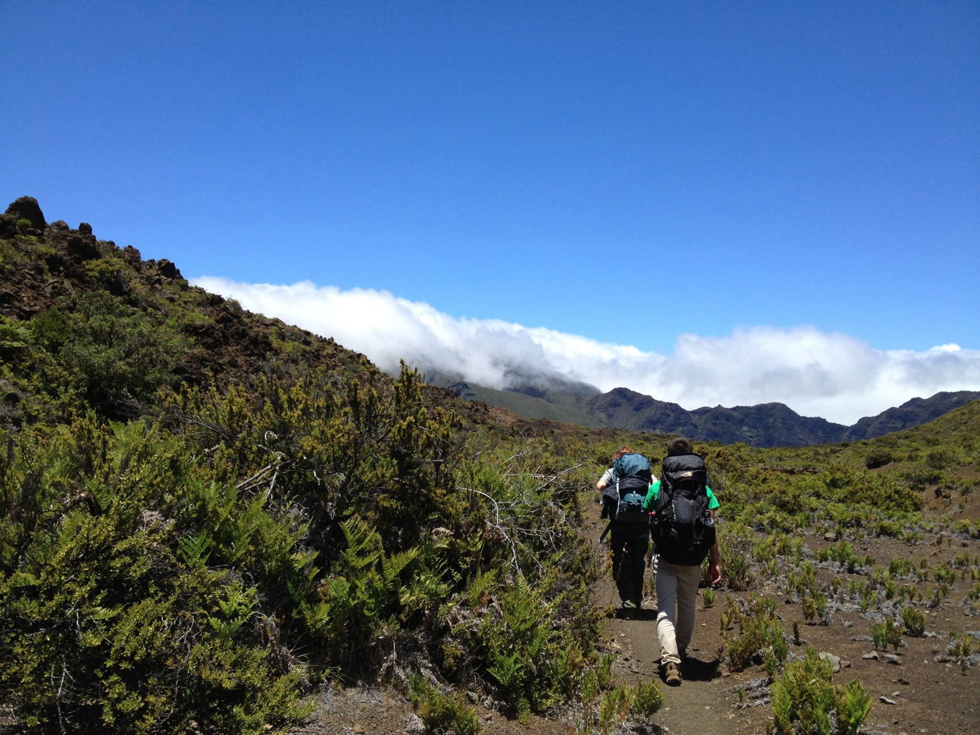 Backpackers head through Haleakala National Park.