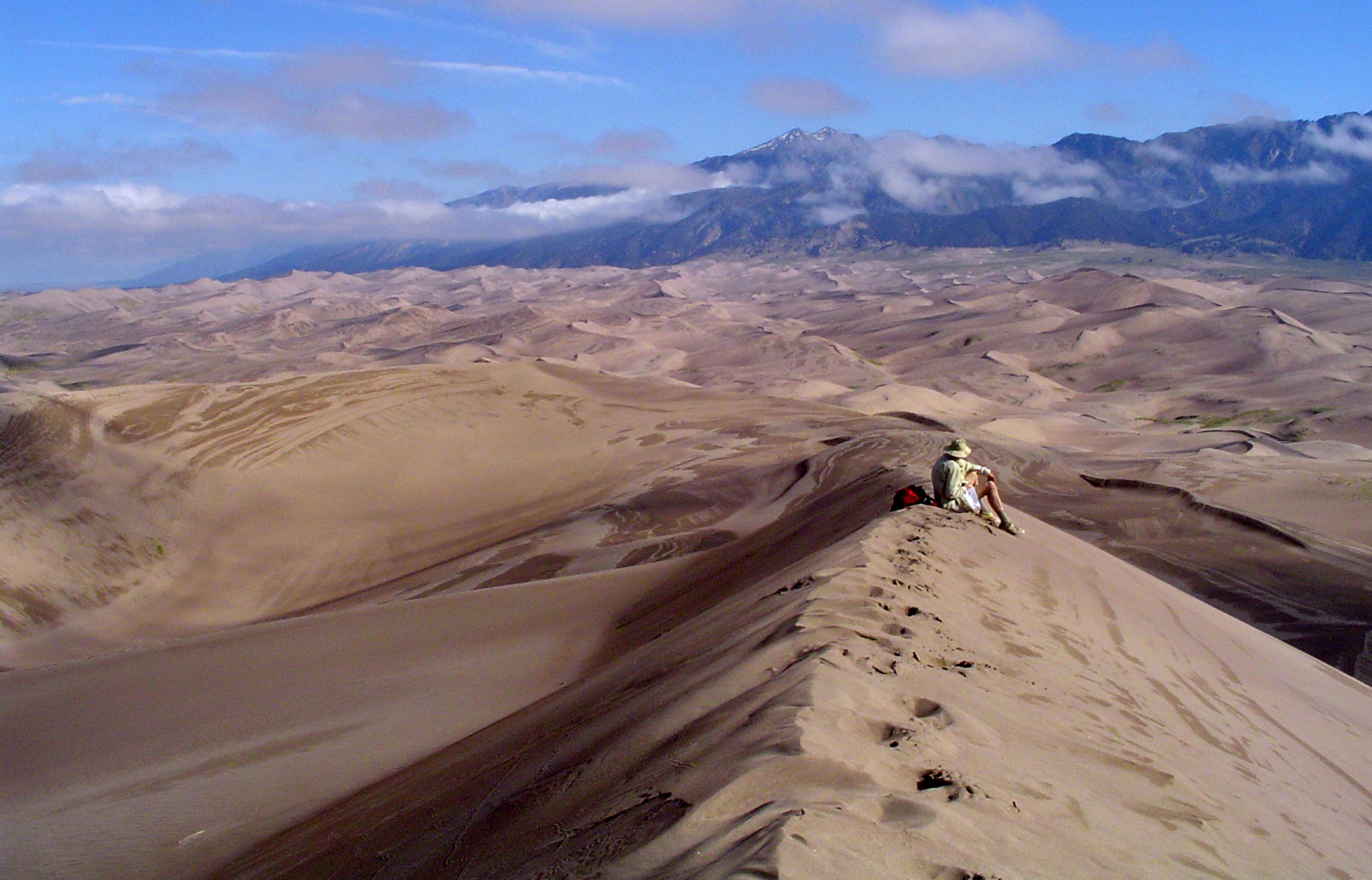 A solo hiker in Great Sand Dunes National Park in Colorado.