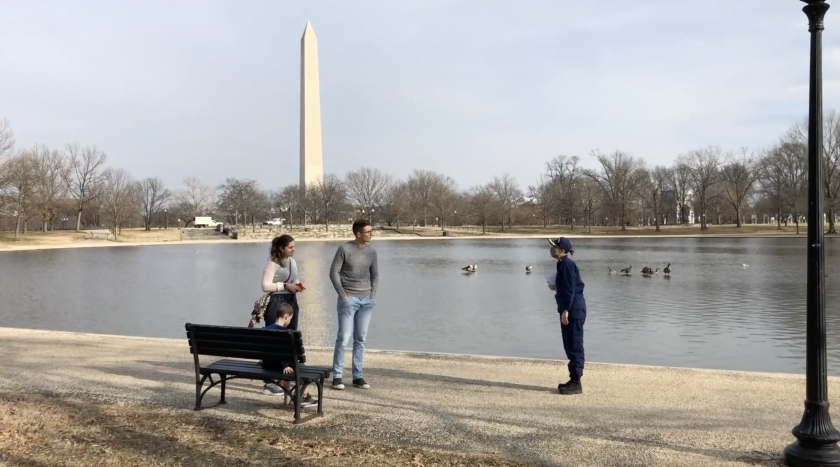 Captain Maria Said talks with visitors, socially distanced, on the National Mall