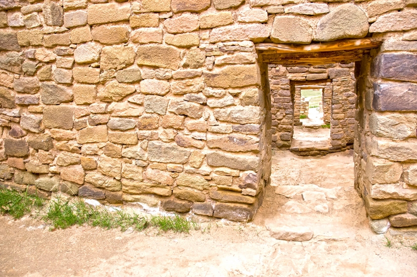 View through a stone doorway of more stone doorways 