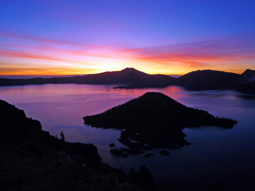 Rainbow-colored sunrise over Crater Lake National Park